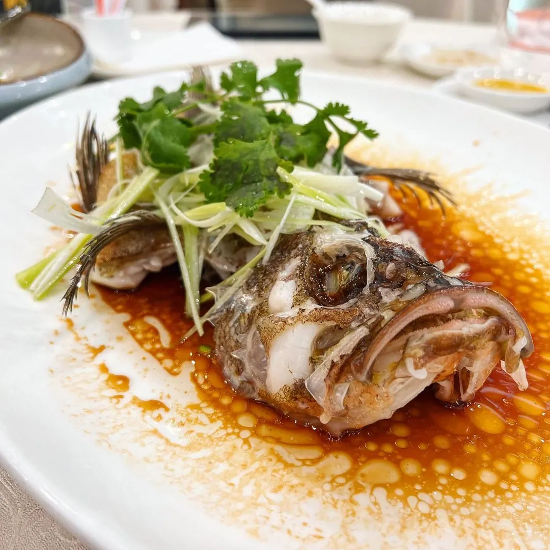 Whole fish steamed with scallion and soy
